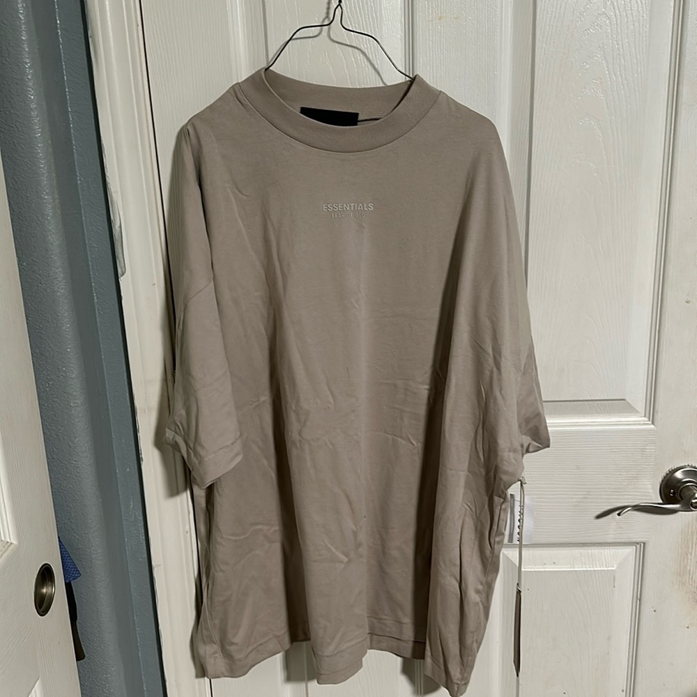 Brand new with tags Essentials brand tshirt